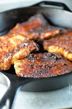 some food is cooking in a skillet on the stove top and ready to be eaten