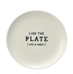 a white plate with the words, lick the plate life is sweet on it's side