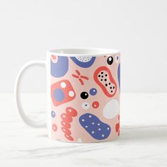 a coffee mug with an abstract design on it