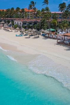 an aerial view of the beach and resort