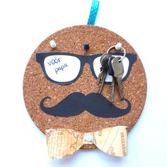 a cork board with a man's face, sunglasses and a bow tie on it