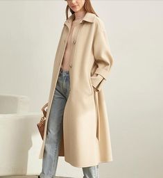 Product Description: This is a handmade cashmere coat high grade fabric,cashmere fabric.also could be custom made with any size and other colors,please feel free to contact with me if you want custom it. Material: wool 80%- 90% Size: S: Bust : 110 cm shoulder:51cm Sleeve:50cm Length:107 cm M: Bust : 114 cm shoulder:52cm Sleeve: 51 cm Length: 107 cm L: Bust : 118 cm shoulder:53cm Sleeve:52 cm Length:107 cm XL: Bust :122 cm shoulder:54cm Sleeve:53 cm Length:107 cm Long Beige Outerwear For Winter, Beige Long Outerwear For Winter, Winter Long Single Breasted Outerwear, Winter Long Single-breasted Outerwear, Single Breasted Long Winter Outerwear, Long Single-breasted Winter Outerwear, Wool Long Sleeve Sweater Coat For Office, Office Outerwear With Stand Collar For Fall, Fall Office Outerwear With Stand Collar