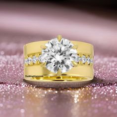 a yellow gold wedding set with a round diamond and channeled diamonds on the band