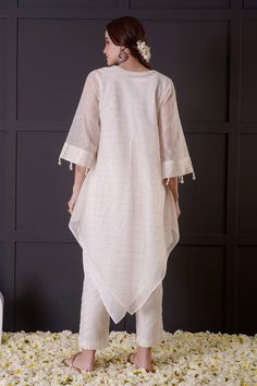 White mul chanderi asymmetric kurta with sequins embroidery. Comes with straight pant. - Aza Fashions Festive Eid Kurta With Asymmetrical Hem, Eid Festive Kurta With Asymmetrical Hem, Traditional Asymmetrical Hem Kurta For Eid, Designer Kurta With Asymmetrical Hem For Eid, Designer Asymmetrical Hem Kurta For Eid, Festive Asymmetrical Hem Kurta For Eid, Summer Cotton Silk Kurta With Mirror Work, Festive Kurta With Dupatta And Asymmetrical Hem, Eid Asymmetrical Hem Sets With Dupatta