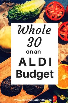 the words whole 30 on an aldi budget surrounded by fruits and vegetables, including oranges