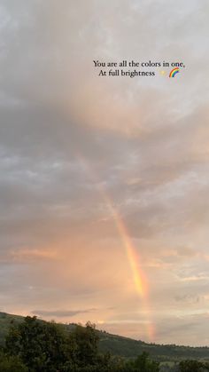 a rainbow in the sky with a quote above it