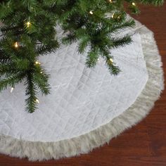 a christmas tree skirt on top of a wooden table