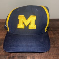 Nwot Michigan Dri Fit Jordan Hat Nike Baseball Cap, One Size Fits Most, Blue Collegiate Hat With Curved Brim, Collegiate Blue Hat With Curved Brim, Blue Curved Brim Collegiate Hat, Collegiate Blue Cap, Collegiate Blue Cap Hats, Collegiate Blue Baseball Cap, Adjustable Yellow Sports Hat, Yellow Cap For Sports Events