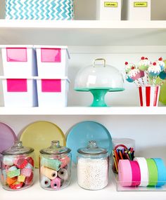 the shelves are filled with different types of crafting supplies and storage bins on them