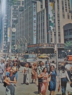 an old photo of people crossing the street in front of tall buildings and skyscrapers