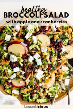 broccoli salad with apples and cranberries in a wooden bowl