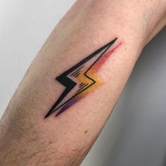 a man's arm with a lightning bolt tattoo on the left side of his arm