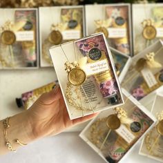 a person holding up a card with some gold coins on it and other cards in the background