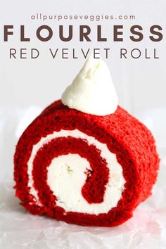 a red velvet roll with white frosting on top and the words flourless red velvet roll