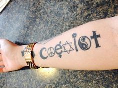 a person with a cross tattoo on their arm