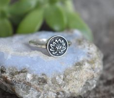 Lotus Flower Ring details:-Solid .925 sterling silver-Lotus 14mm round-Smooth ring band measures 2mm wide-Comfortable and easily stackable!- US sizes 4-12.5 with half sizes-Set of two includes Chevron Bead band 1.5mmConnect with us on Instagram @a_wild_violet for sales and giveaways!**All items are in stock and ship within 2-5 business days from received payment (excluding Saturday/Sunday) from the US. If you are within the US please expect 3-7 business days for shipping transit and delivery. In Silver Hypoallergenic Flower Ring, Adjustable Stackable Flower Ring, Sterling Silver Spiritual Flower Ring, Sterling Silver Stackable Flower Ring, Nickel-free Flower Ring For Promise, Adjustable Hypoallergenic Flower Ring, Lotus Flower Ring, Yoga Ring, Lotus Ring