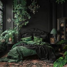 a bed with green sheets and pillows in a dark room next to plants on the wall