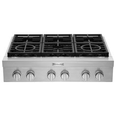 a stainless steel stove top with four burners