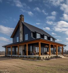 a large house sitting on top of a dry grass field