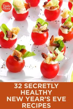 small tomatoes with bacon, lettuce and tomato slices in them on a white plate