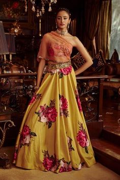 Peach organza and silk draped one shoulder choli. Paired with yellow hand painted and printed lehenga.
Component: 2
Pattern: Hand painted, Printed
Type Of Work: Floral motifs,
Neckline: One shoulder
Sleeve Type: Draped sleeve
Fabric: Viscose silk, Organza
Color: Yellow,Peach
Other Details: 
Embroidered detail
Occasion: Reception - Aza Fashions Lehenga And Blouse, Printed Lehenga, Yellow Lehenga, Embellished Belt, Draped Blouse, Drape Sleeves, Silk Organza, Floral Motifs, Embroidered Silk