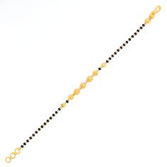 This iconic striped 22k gold bracelet, weighing 4.7 grams, features a stunning yellow gold finish complemented by elegant black beads. Spanning 7 inches in length and equipped with 0.6" adjustable links, it offers a personalized fit, secured by a hook lock. Ideal for those who value classic design with a modern edge, this piece elegantly marries the timeless appeal of gold with the chic contrast of black beads. It stands as a versatile and stylish addition to any jewelry collection, perfect for Black Bead Bracelet, 22k Gold Bracelet, Bridal Jewelry Necklace, Precious Stones Rings, Statement Rings Diamond, Diamond Pendant Sets, Black Beaded Bracelets, Modern Bracelets, Fancy Necklace