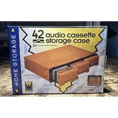 the box is open to reveal an audio cassette storage case