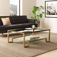 a living room scene with focus on the couch and coffee table