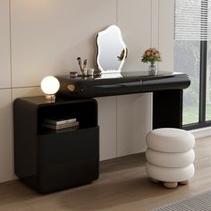 a desk with a mirror, stool and vase on it