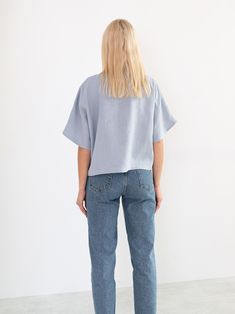 "BEE is a simple loose fitting short sleeve linen top. DETAILS - Boat neckline - Short sleeve - Kimono sleeves - Pullover design - Cropped length - 100% lightweight European linen fabric - Cut and sewn to order just for you in our studio COLOR - Bluestone, you can also choose other colors above - Fabric samples are available here https://www.etsy.com/listing/586569696/linen-fabric-samples SIZING & FIT - Fits true to size - Length is approximately 20 inches / 51.5 cm - Bust (pit to pit) is ap Everyday Cropped Linen Top, Linen Tops With Rolled Short Sleeves, Boxy Short Sleeve Blouse For Summer, Summer Blouse With Short Sleeves, Effortless Boxy Short Sleeve Top, Blue Linen Short Sleeve Top, Flax Color Cotton Short Sleeve Tops, Flax Color Short Sleeve Cotton Tops, Modern Linen Short Sleeve Tops