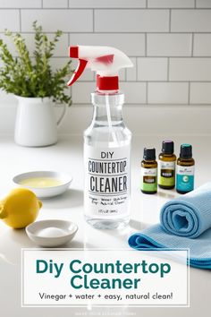 a bottle of countertop cleaner sitting on top of a table next to other cleaning supplies