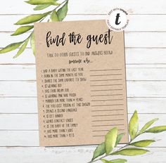 the printable wedding game is shown on a wooden table with leaves and greenery