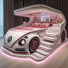 a bed made to look like a vw buggy is lit up with pink lights