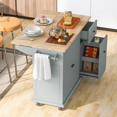 a kitchen island with an open drawer in the middle