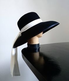 A classical New Look shape hat with Audrey vibes. Hand made to measure. Diameter: cca 42 cm Crown depth: cca 10 cm Available only in black at the moment Audrey Hepburn Hat, Audrey Hepburn Inspired, Cloche Hats, Breakfast At Tiffany's, Elegant Hats, White Scarves, Fancy Hats, Breakfast At Tiffanys, Cloche Hat