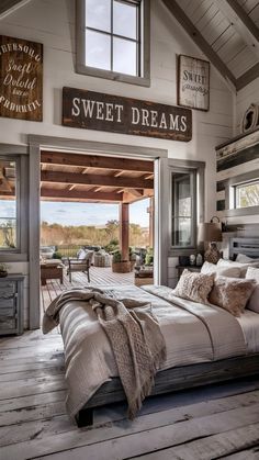 a bed sitting inside of a bedroom on top of a wooden floor next to a window