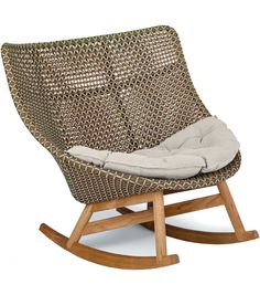 a wicker rocking chair with a cushion on it