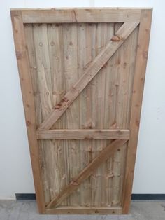 an unfinished wooden door is shown in this image, it appears to be made out of wood