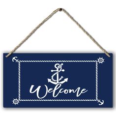 a sign that says welcome with an anchor and rope hanging from the side of it