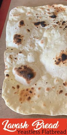 a flatbread is sitting on top of a mat with the words toasted bread over it