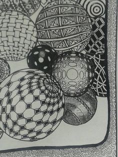 a black and white drawing of some balls