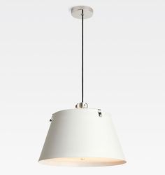 a white pendant light hanging from a ceiling