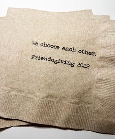 two pieces of brown paper with black writing on them that say we choose each other