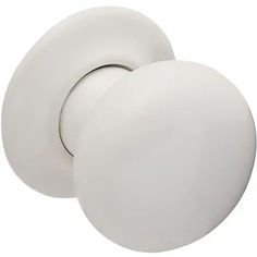 two white knobs on the side of a door