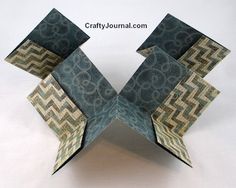 an origami box with geometric designs on it