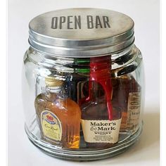 an open jar filled with liquor bottles and labeled minibar in a jar grooms man gift idea