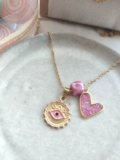 Necklace with chain length 50 cm + 5 cm extension chain Material: gold-plated stainless steel. Pink Heart Charm Round Pendant Jewelry, Pink Round Pendant Jewelry With Heart Charm, Pink Round Pendant With Heart Charm, Dainty Pink Charm Necklace With Delicate Chain, Pink Heart Pendant Jewelry With Adjustable Chain, Pink Heart Shaped Necklace With Adjustable Chain, Pink Round Pendant Gold Plated Jewelry, Pink Gold-plated Jewelry With Adjustable Chain, Pink Gold Jewelry With Adjustable Chain For Gift