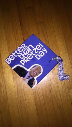 a blue graduation cap that has been placed on the floor