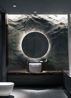 a bathroom with a round mirror on the wall