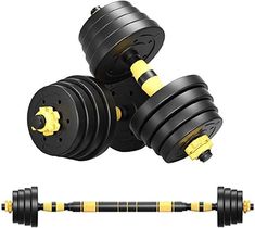 two black and yellow dumbbells are next to each other